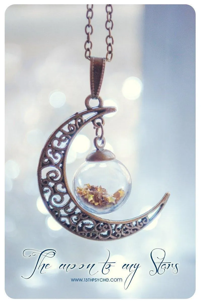 Bronze crescent moon globe necklace with glitter stars